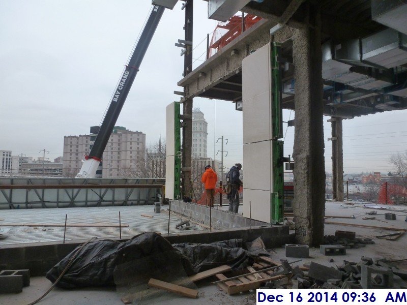 Erecting the stone panels at the North Elevation UCIA roof Facing East